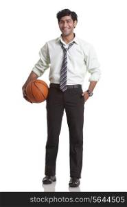 Businessman holding a basketball