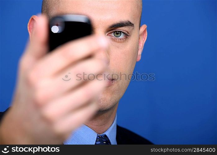 businessman holding a cell