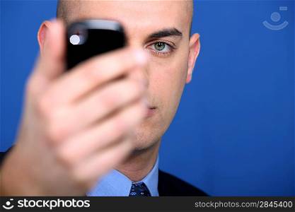 businessman holding a cell