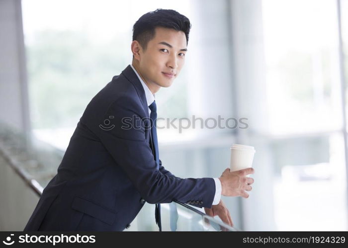 Businessman holding a coffee cup