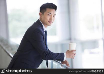 Businessman holding a coffee cup
