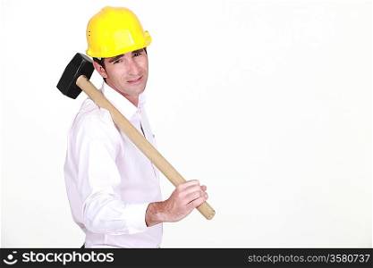 businessman holding a helmet and a hammer