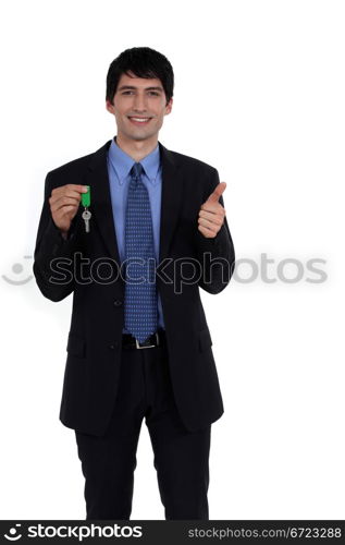 businessman holding a key