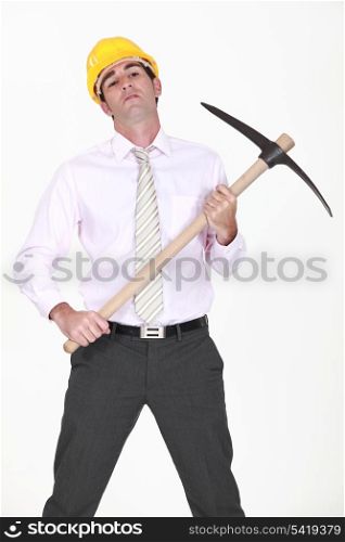 businessman holding a pickax
