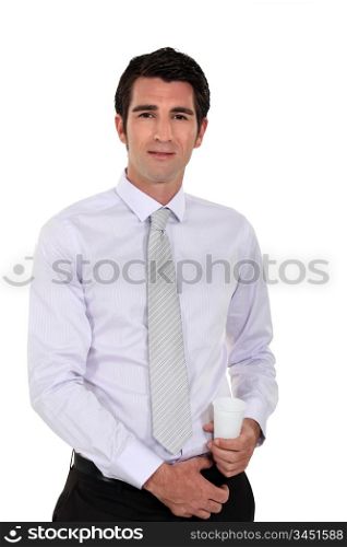 Businessman holding a plastic disposable cup