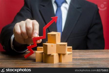 Businessman holding a red arrow up over boxes. Increase sales rate, industrial goods production volumes growth , expanding export opportunities, finding new markets. Strategy marketing. Supply Demand