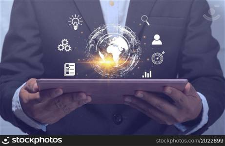 Businessman holding a tablet, displaying information, networking online, to the world, communication concept, use of technology for work, business, online, information search, global and big data.