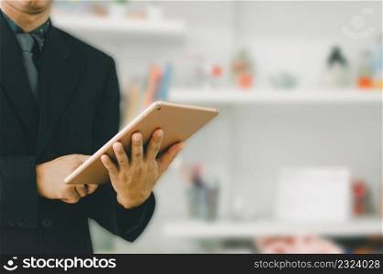 businessman holding a tablet to search for information and do business online.