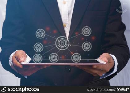 Businessman holding a tablet used for online shopping internet surfing Utilization of the device