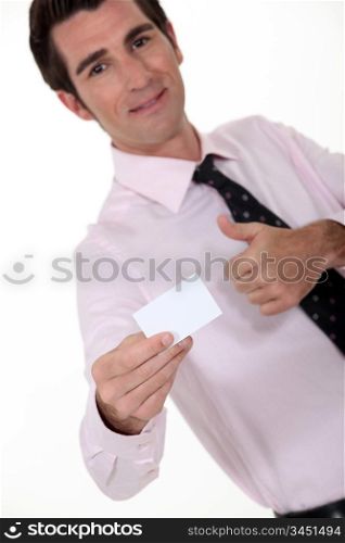 businessman holding a visit card