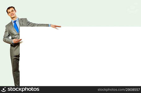 Businessman holding blank banner