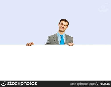 Businessman holding blank banner