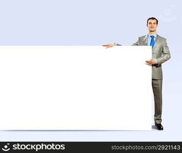 Businessman holding blank banner