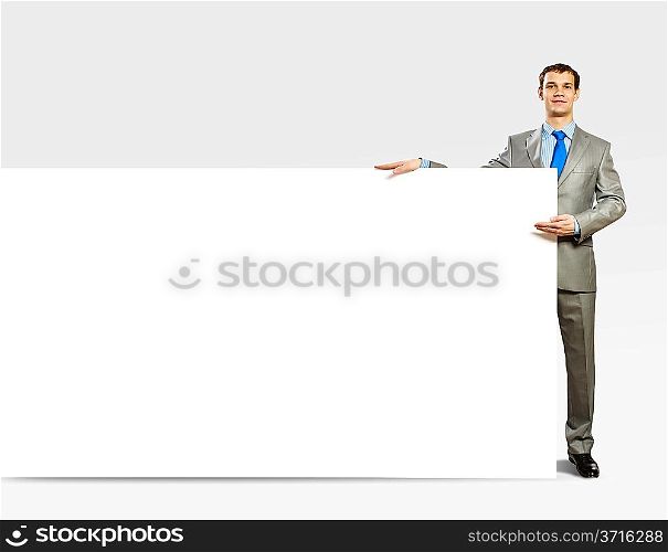 Businessman holding blank banner