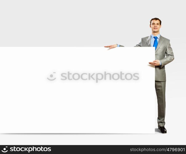 Businessman holding blank banner. Advertising manager with billboard. Place for text