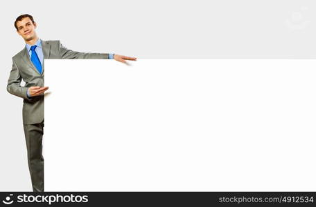 Businessman holding blank banner. Advertising manager with billboard. Place for text