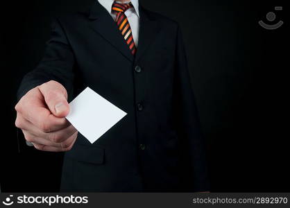 businessman holding blank card