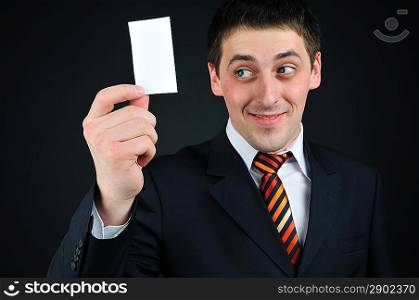 businessman holding blank card