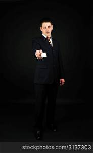 businessman holding blank card