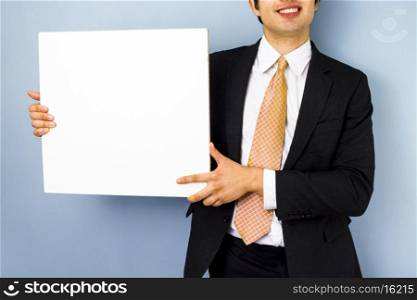 businessman holding blank sign