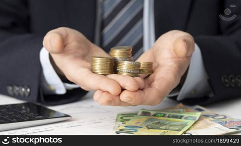businessman holding bunch coins 2. Resolution and high quality beautiful photo. businessman holding bunch coins 2. High quality beautiful photo concept
