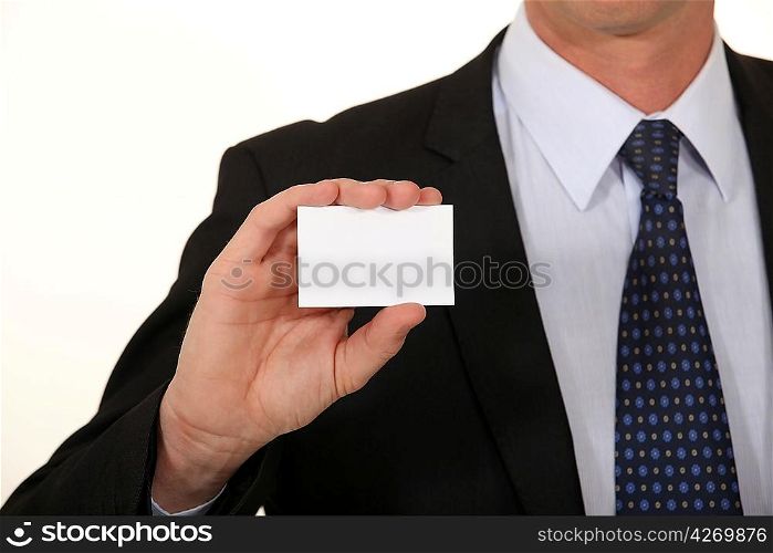 Businessman holding card