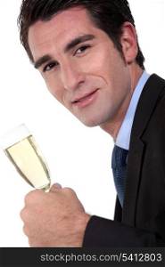 Businessman holding champagne flute