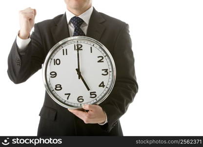 Businessman Holding Clock