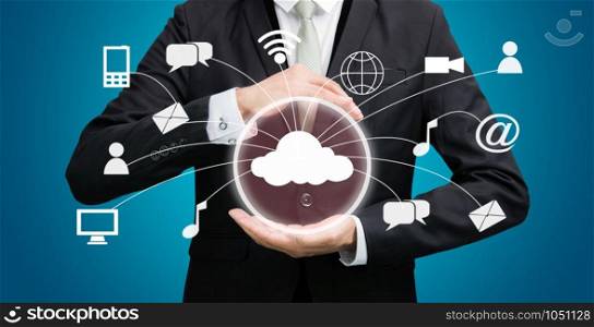 Businessman holding cloud computing network on blue background