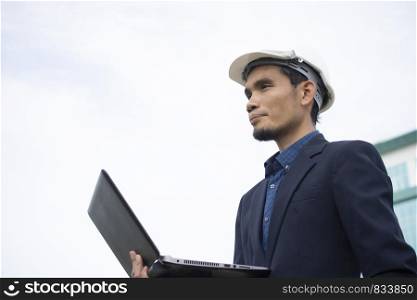 Businessman holding computer notebook