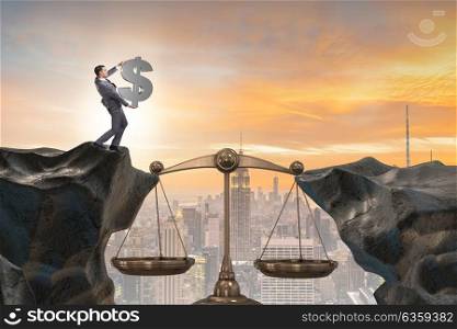 Businessman holding dollar sign in justice concept
