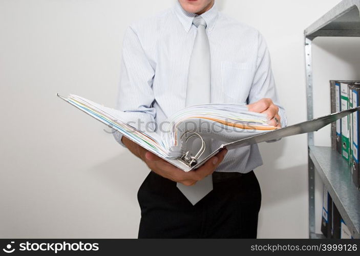 Businessman holding file