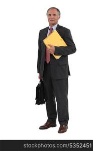 Businessman holding folders