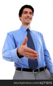 Businessman holding hand out