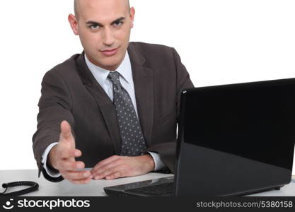 Businessman holding his hand out for a handshake