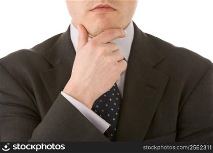 Businessman Holding His Hand Up To His Chin