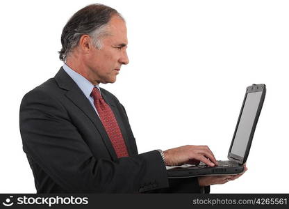 Businessman holding his laptop