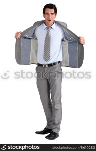 Businessman holding jacket open