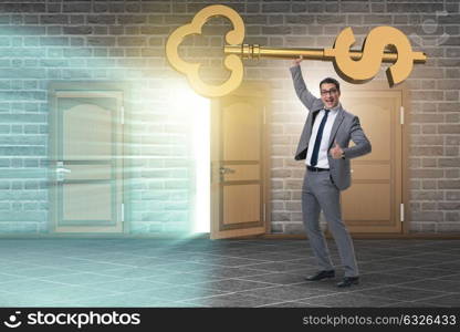 Businessman holding key to financial success and prosperity