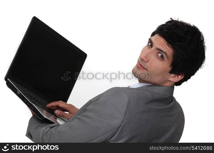 Businessman holding laptop