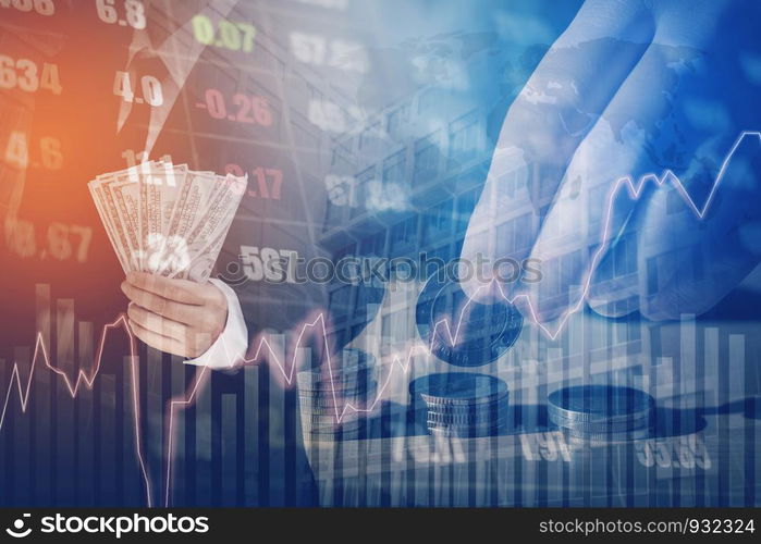 Businessman Holding money US dollar bills on digital stock market financial exchange and Trading graph Double exposure city on the background