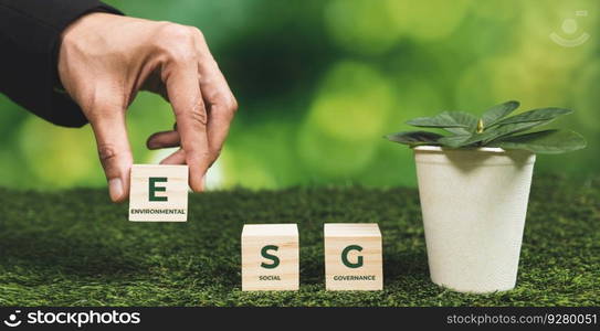 Businessman holding plant pot with ESG cube symbol. Forest regeneration and natural awareness. Ethical green business with eco-friendly policy utilizing renewable energy to preserve ecology. Alter. Businessman holding plant pot with ECO cube symbol. Alter