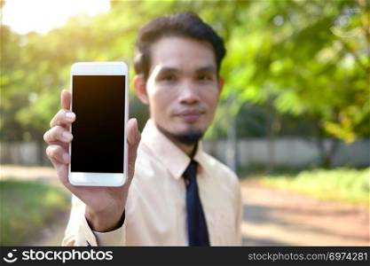 Businessman holding smart phone and using  internet online