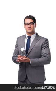 Businessman holding star award in business concept