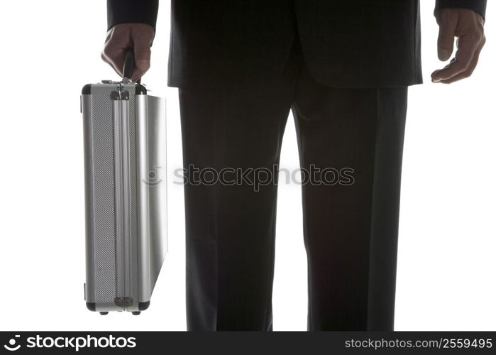 Businessman Holding Sturdy Silver Suitcase