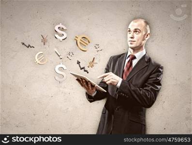 Businessman holding tablet pc. Image of businessman holding tablet pc. Finance concept