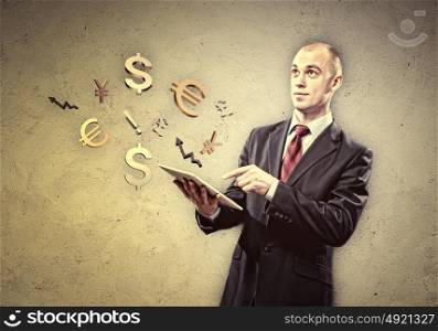 Businessman holding tablet pc. Image of businessman holding tablet pc. Finance concept