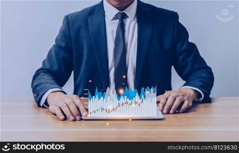 Businessman holding tablet with business growth graph chart. Digital marketing and stock market concept.