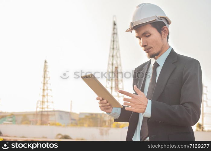 ?Businessman holding tablet work in building construction site