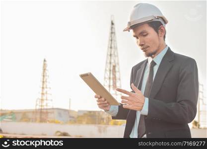 ?Businessman holding tablet work in building construction site